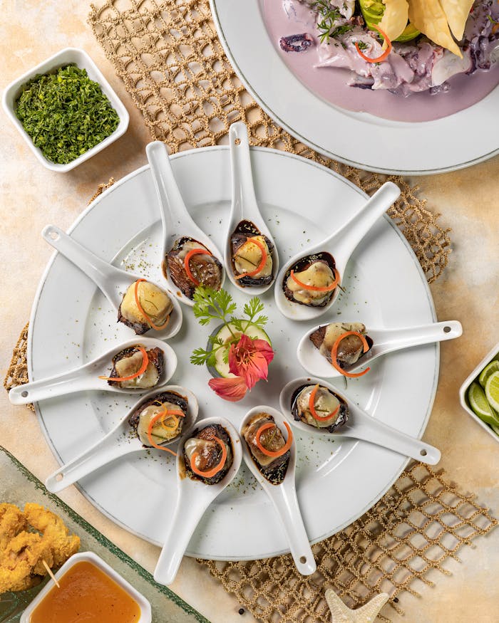Gourmet Peruvian dish elegantly presented in ceramic spoons, showcasing local flavors.